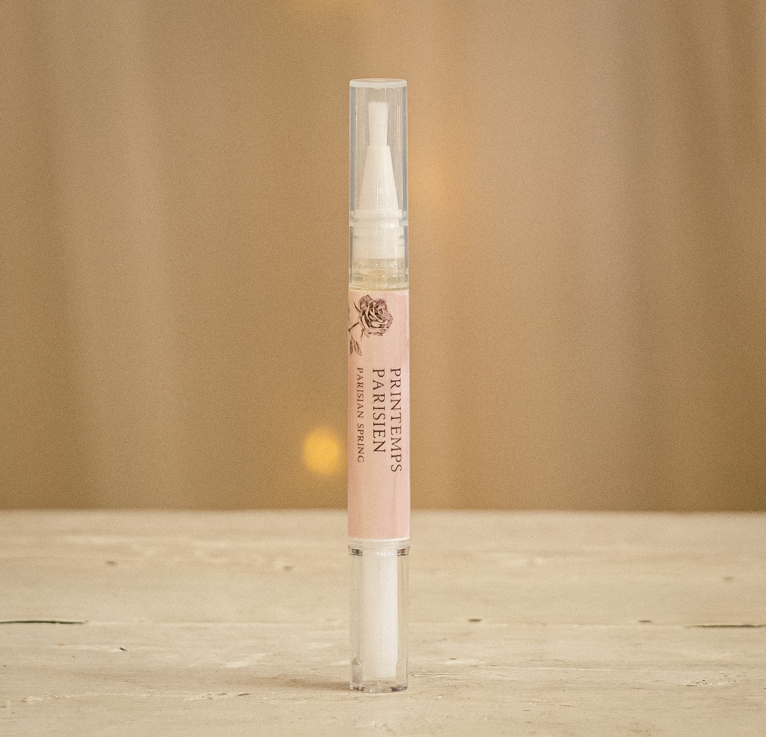 Protect and improve the overall health and appearance of your nails with this cuticle oil pen made by local nail artist Amelia Parker.  Using cuticle oil increases the circulation around your nails and stimulates nail growth. Cuticle oil can also protect your polish for a lasting shine.  Available in Parisian Spring - Raspberry, Vanilla, Rose