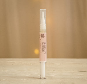 Open image in slideshow, Protect and improve the overall health and appearance of your nails with this cuticle oil pen made by local nail artist Amelia Parker.  Using cuticle oil increases the circulation around your nails and stimulates nail growth. Cuticle oil can also protect your polish for a lasting shine.  Available in Parisian Spring - Raspberry, Vanilla, Rose
